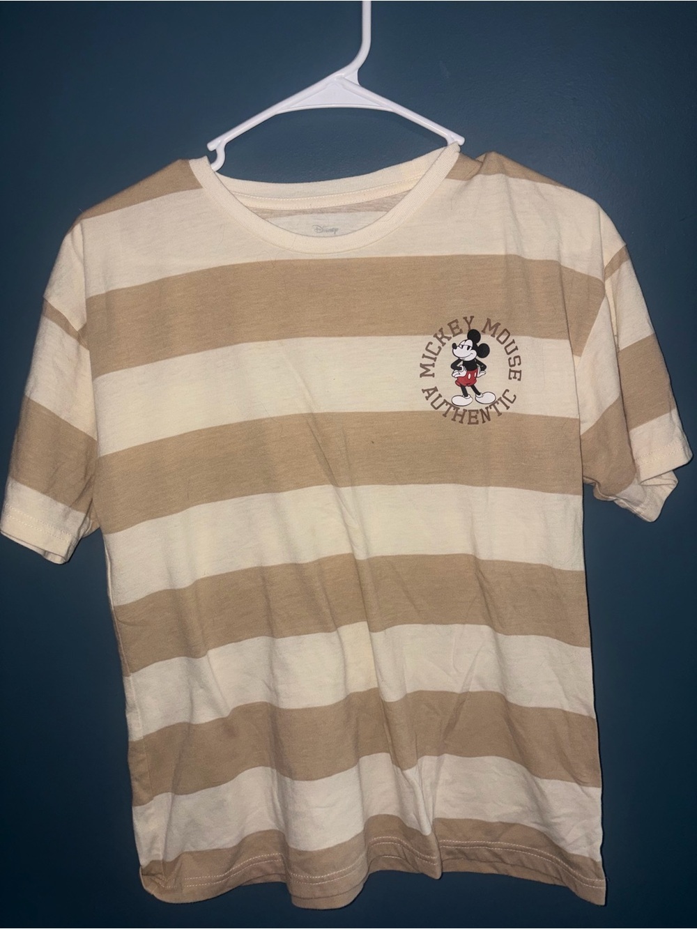 Disney striped t-shirt features a vintage-style "Mickey Mouse Authentic" graphic